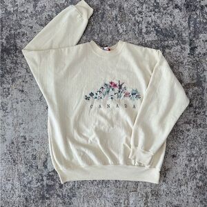 Vintage Cream Crewneck Sweatshirt with Floral Canada Graphic